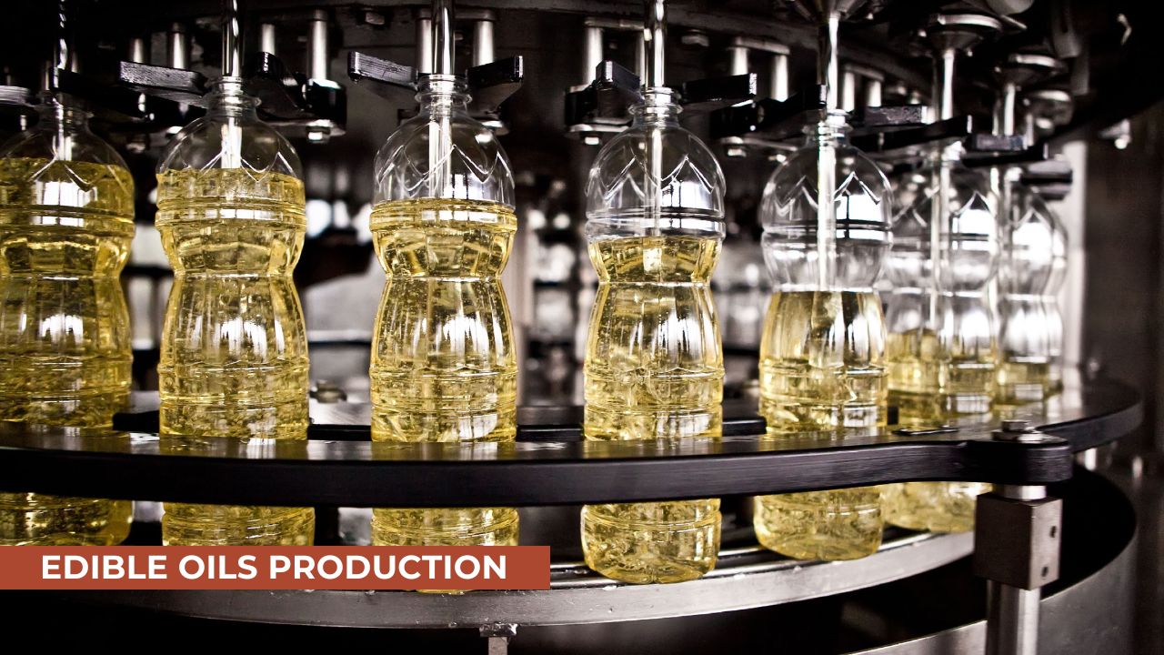 Close-up of a bottling machine filling plastic bottles with edible oil during production. The image showcases a circular production line for packaging edible oils